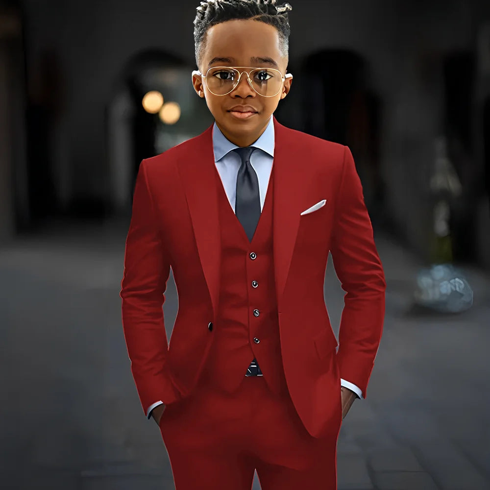 Dark grey high-quality boys' suit set featuring a slim fit, single-breasted jacket, pants, and vest with peak lapel detail.