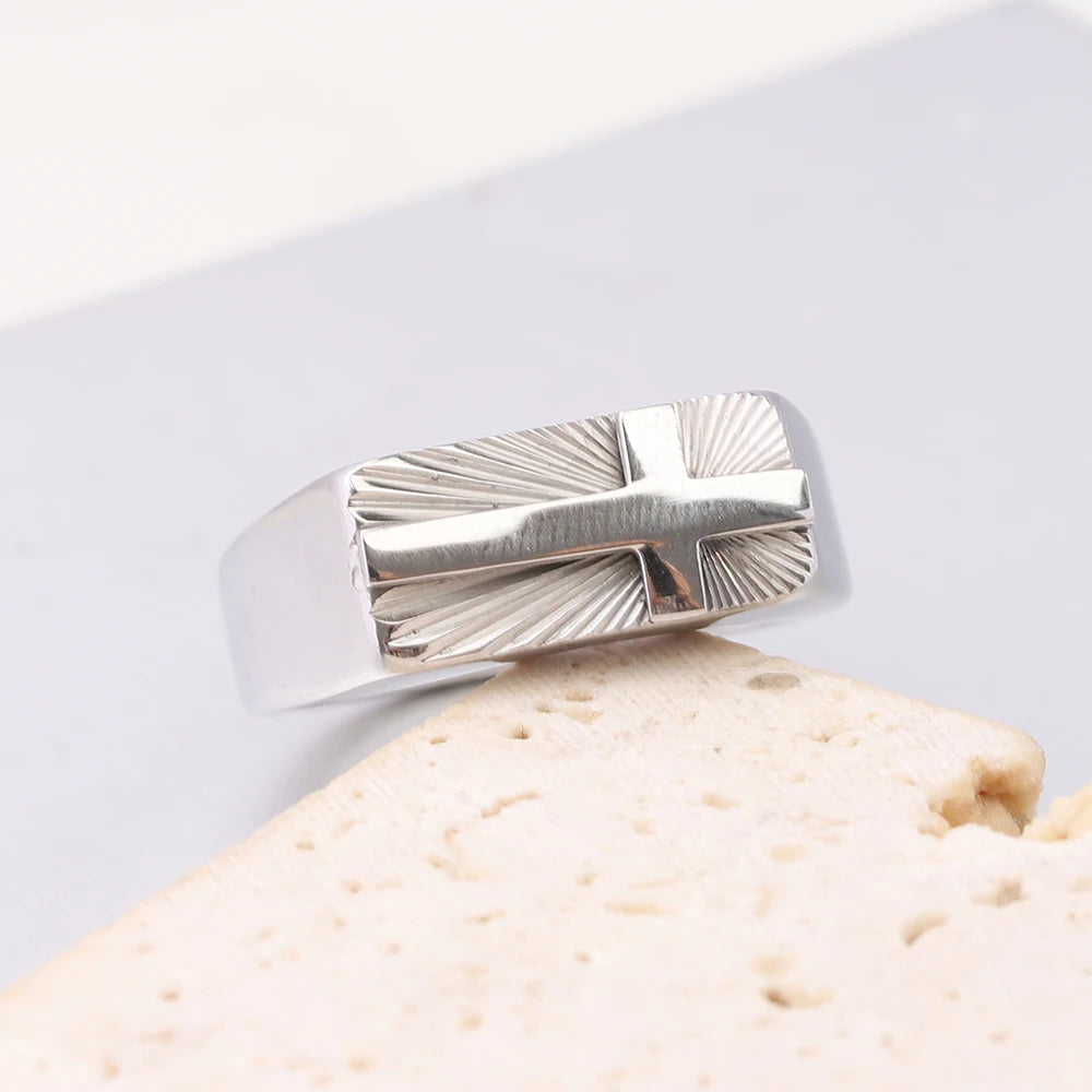 Stainless steel men's cross ring with 8mm sunburst design, religious band style, showing detailed cross engraving and polished finish