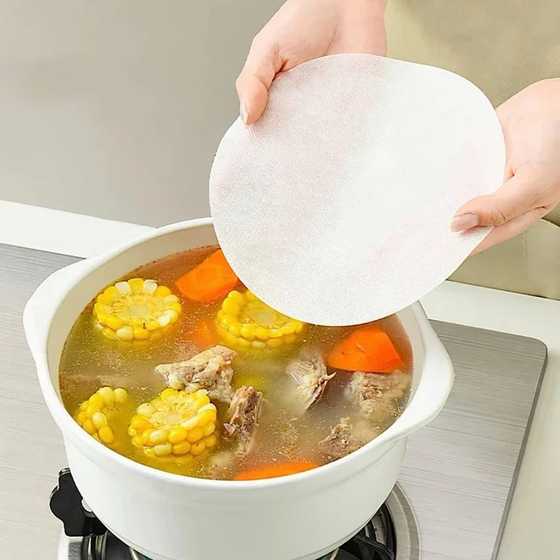 Showlu Smart General kitchen oil absorbing sheets laid out on a countertop, designed to absorb excess oil effectively.