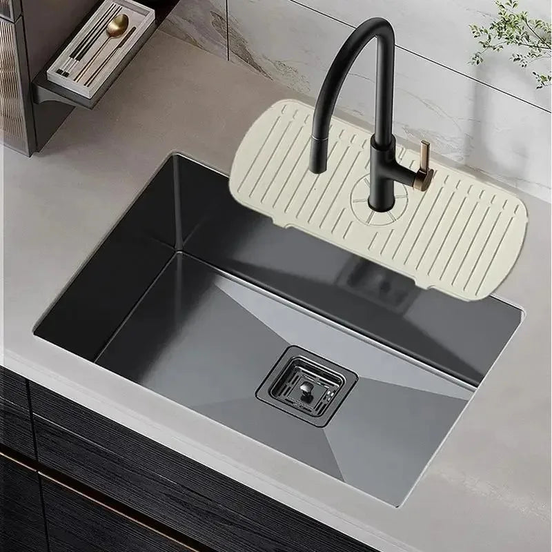 Showlu Smart General silicone faucet splash guard attached to kitchen sink to prevent water splashes during use