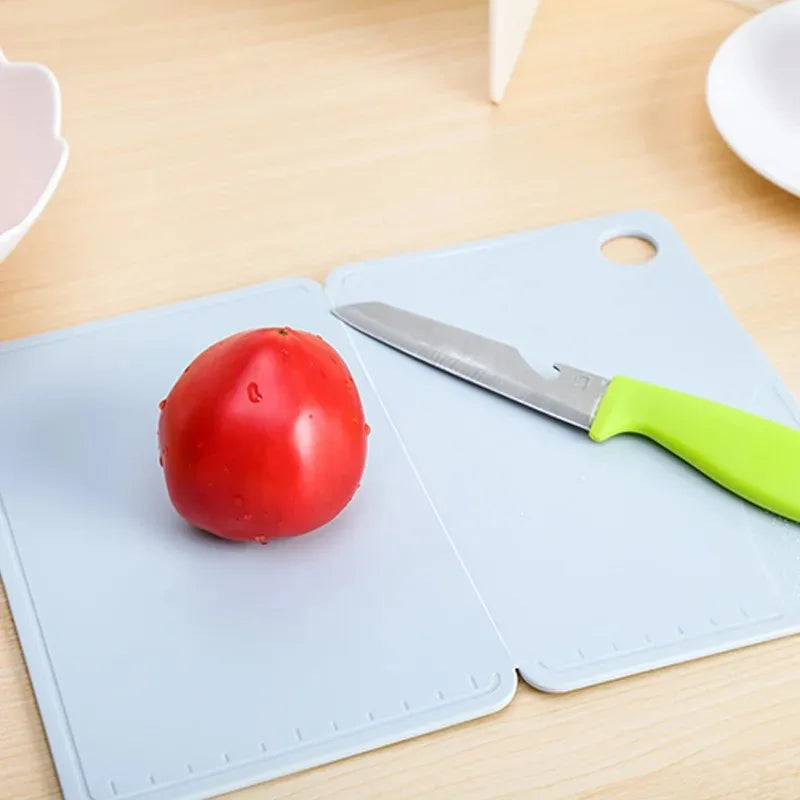 Showlu Smart General collapsible cutting board folded and open, showing its flexible design and compact storage features.