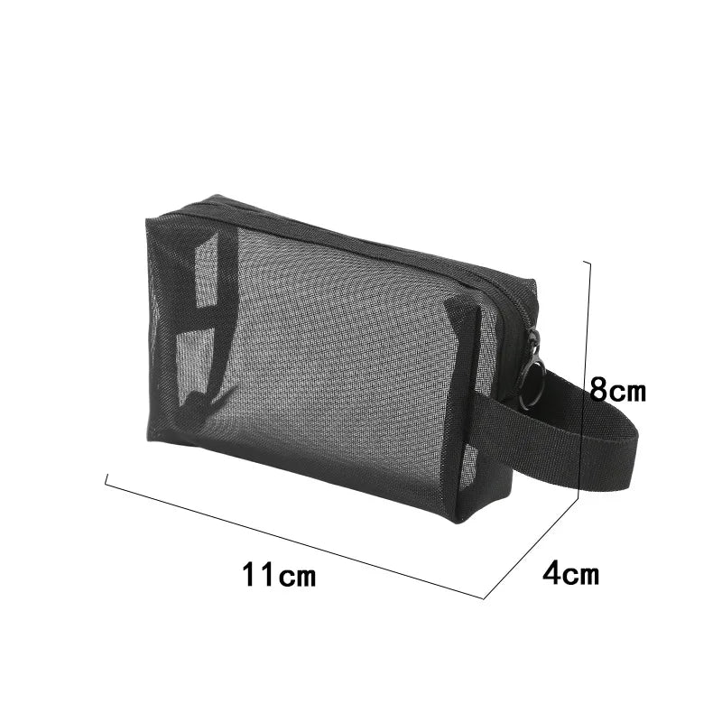 Large black travel cosmetic bag with mesh compartments for makeup and toiletries, ideal for organized cosmetic storage.