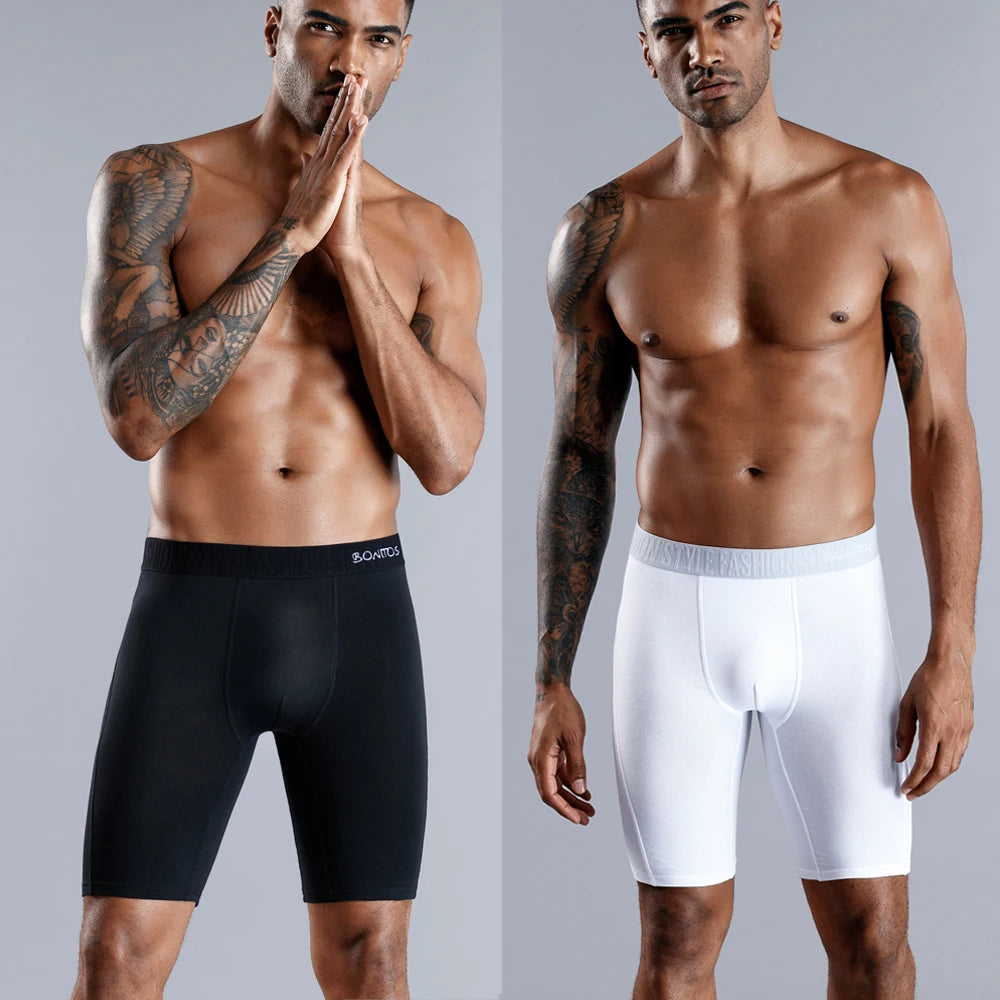 Men's long leg boxer shorts by SRBONITOS, 4-pack cotton trunks in plus size, shown in black and gray.