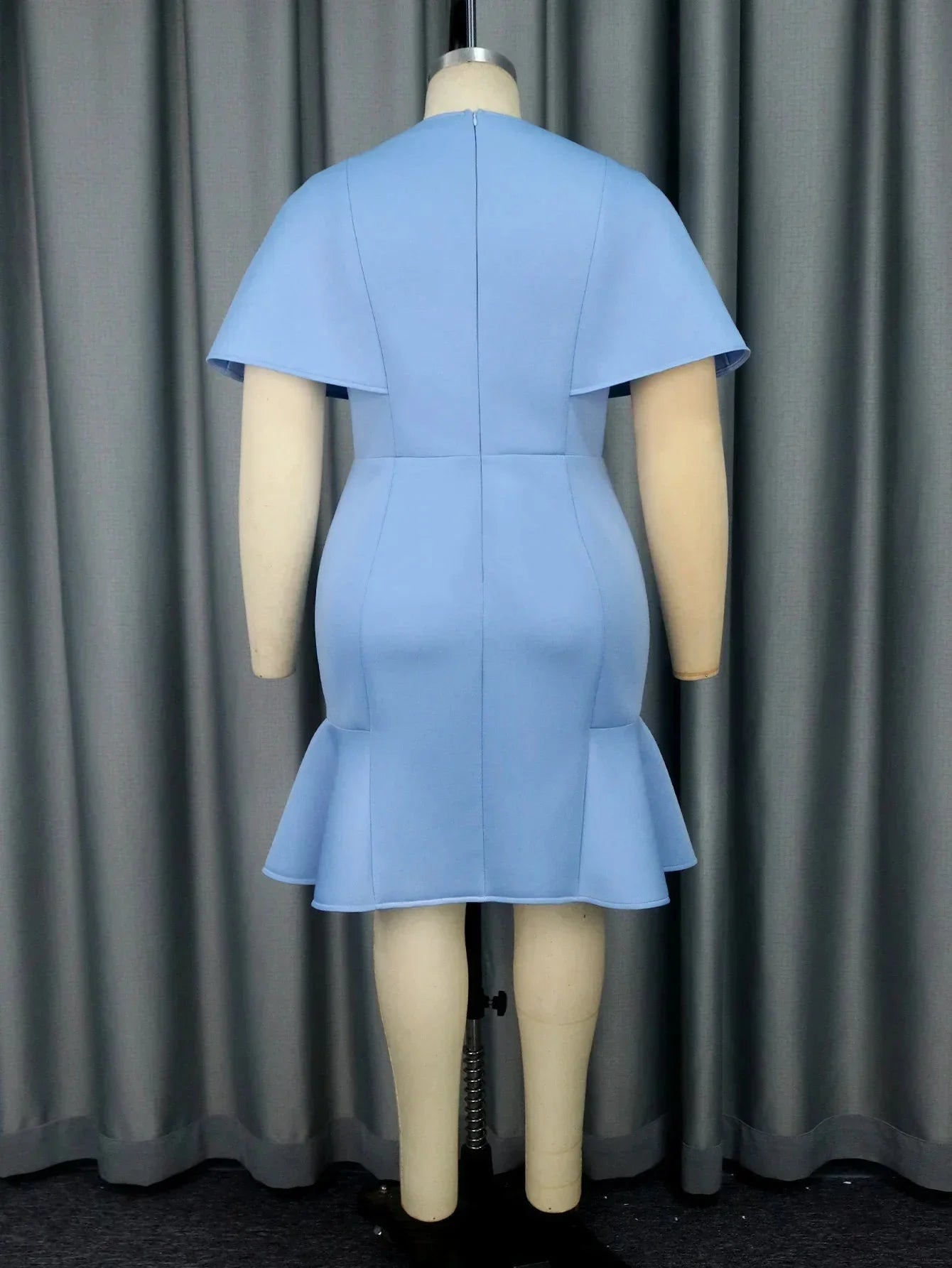 Aimei blue ruffle bodycon mini dress with slim fit and round neckline, perfect for party occasions, shown on a model.