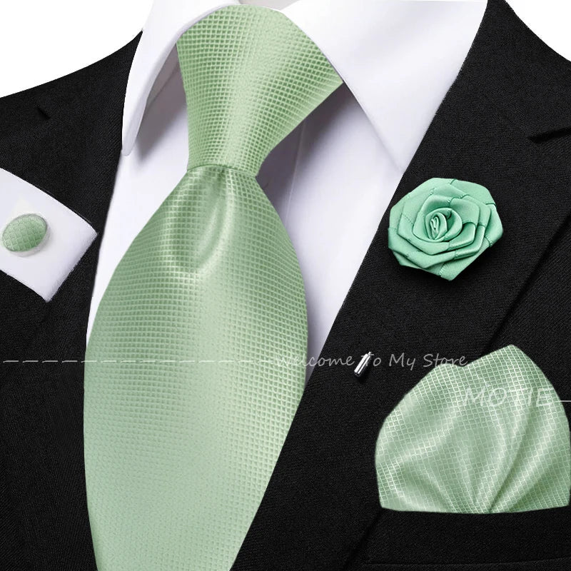 Men's solid green tie set with pocket square, flower brooch, cufflinks, and collar accessory for wedding or daily wear.
