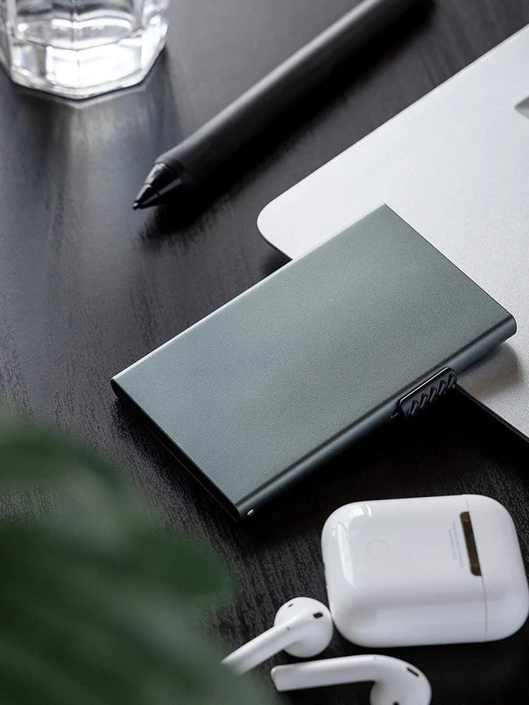 Slim metal RFID blocking pop-up card holder wallet by Showlu Fashion Store, featuring minimalist design and compact metal construction.