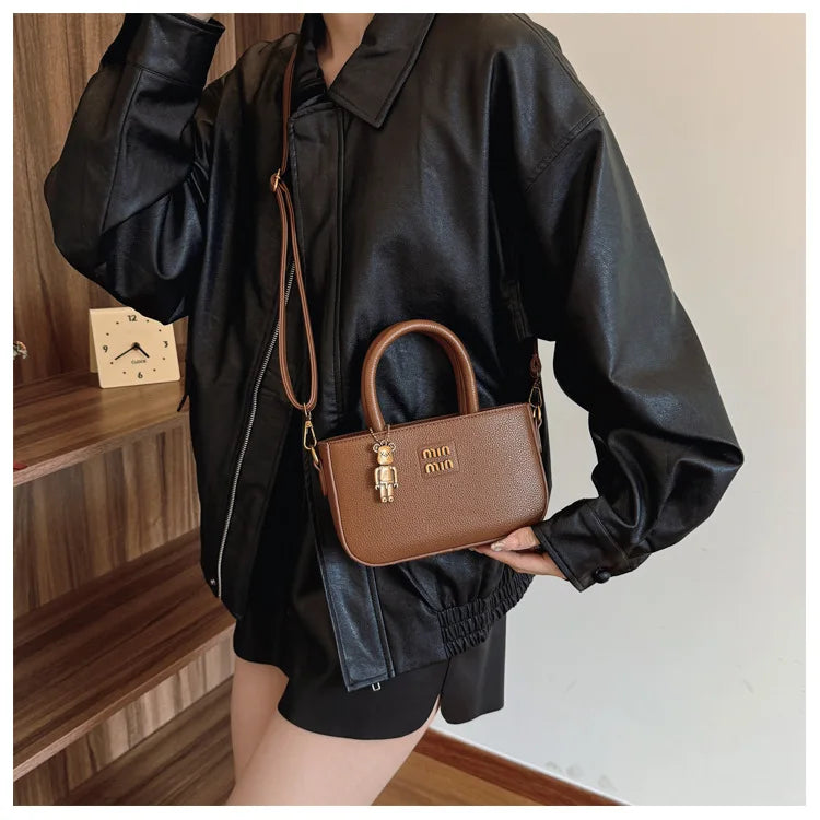 Minimalist luxury phone pouch and shoulder crossbody bag by 1170uf-he, sleek design with compact storage for essentials.