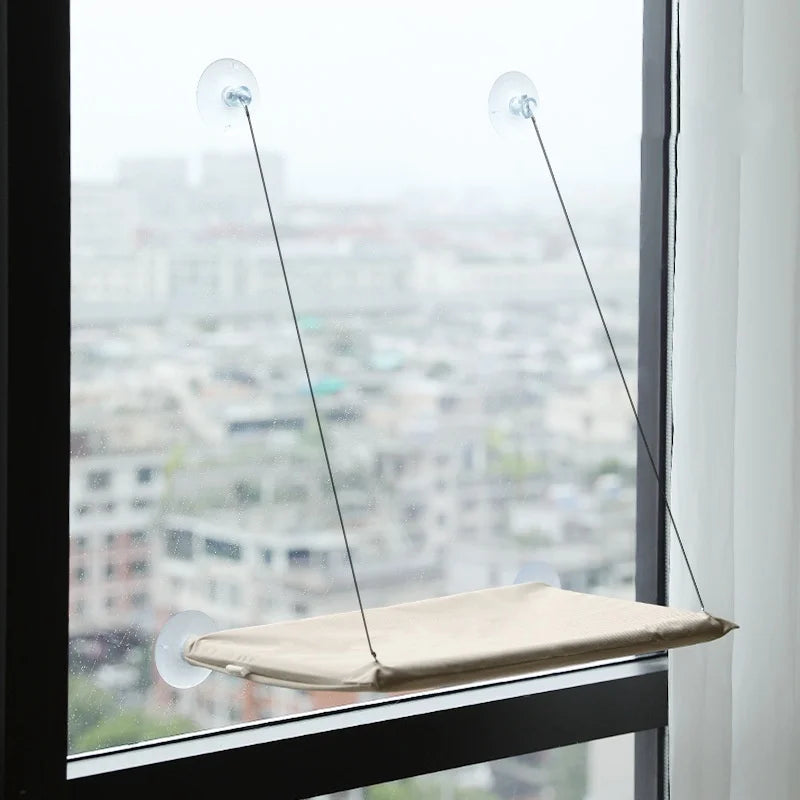 Showlu Smart General cat window hammock attached to a window, providing a cozy resting spot for cats with a supportive fabric design.