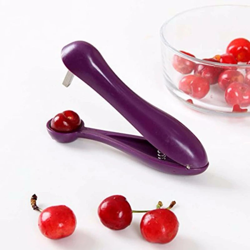 Showlu Fashion cherry pit remover tool for fruits and vegetables, featuring a compact design for easy seed removal from cherries and olives.