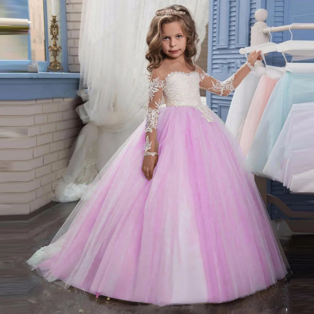 Light pink tulle flower girl dress with white appliques, long sleeves, perfect for weddings, birthdays, and Holy Communion ceremonies.