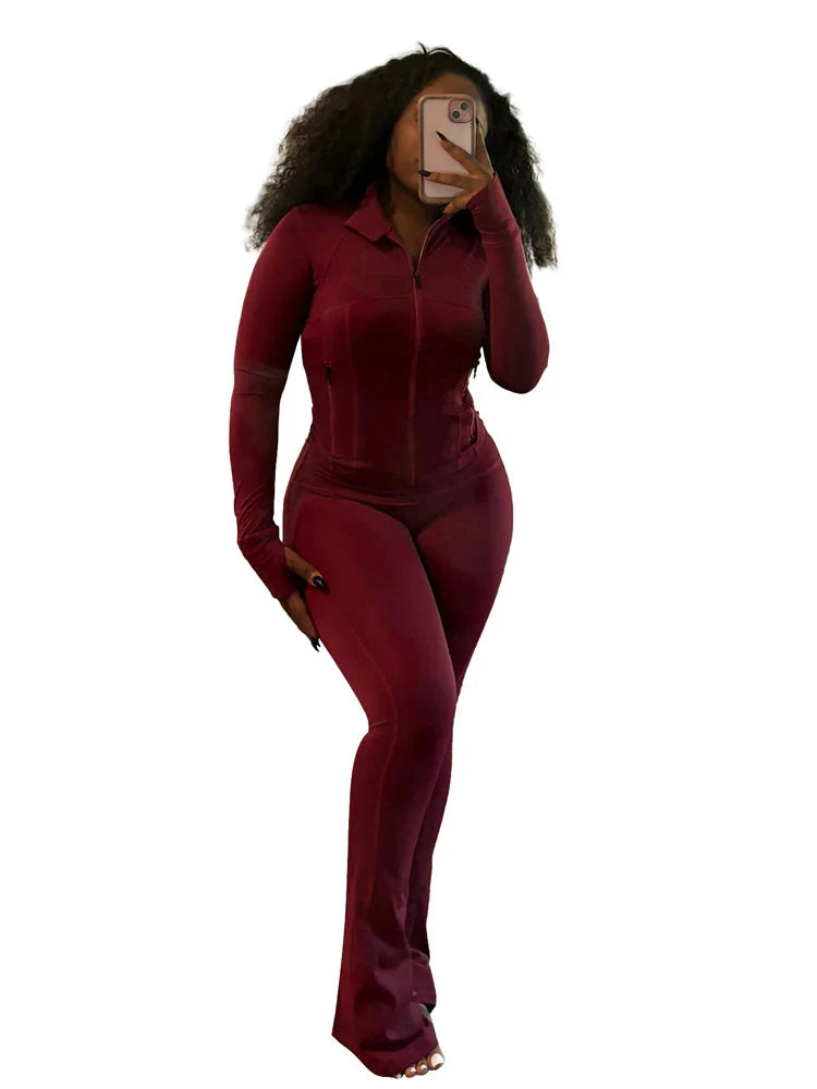 JENYAGE women's two-piece tracksuit with flared pants and zip-up top, stylish athleisure outfit in black fabric.