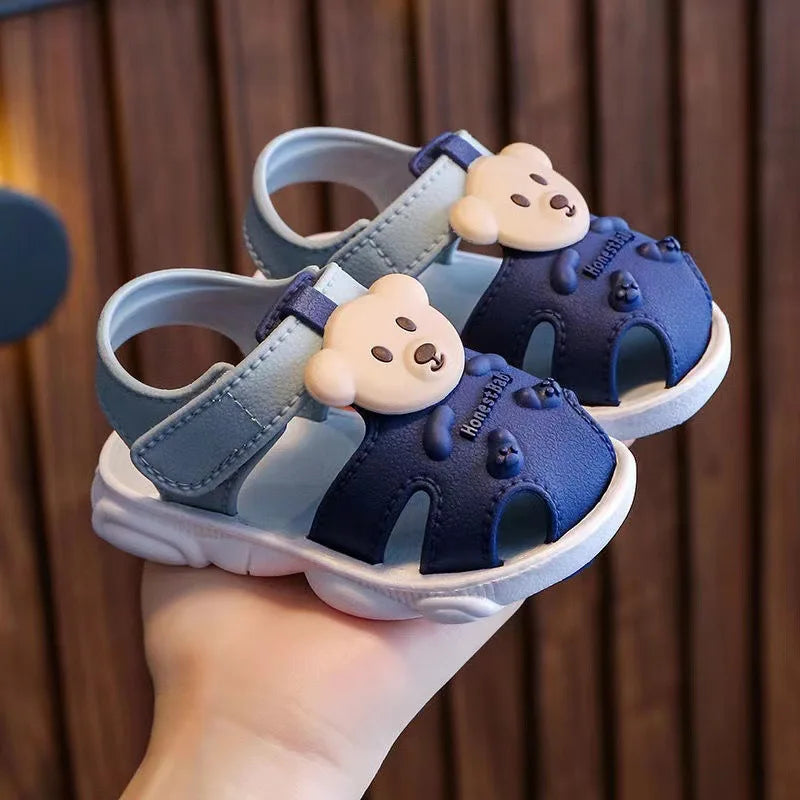Showlu Baby open-toe clogs with anti-slip soft soles, designed for infant walking and comfort, featuring colorful strap details.