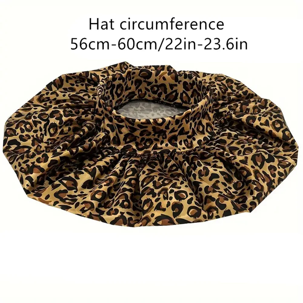 Leopard print women's sleep bonnet with wide elastic band, soft fabric, ideal for dry and textured hair.