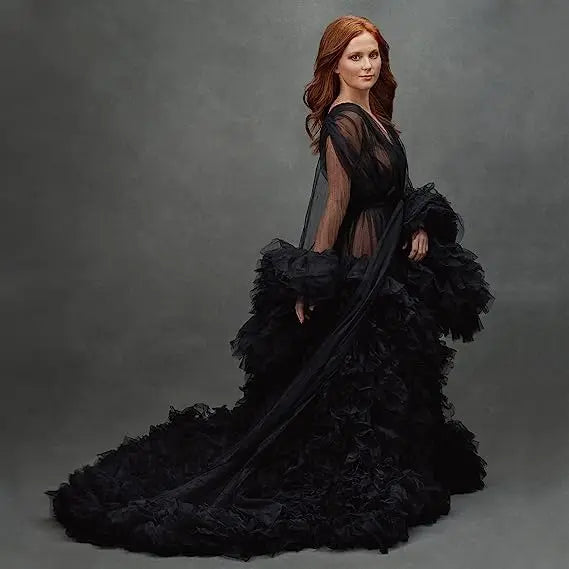 Deep V-neck tulle maternity dress with lace hollow details, long sleeves, feather accents, perfect for photo shoots and special occasions.