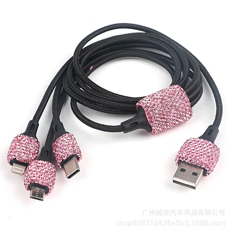 Pink crystal Showlu dual USB car charger with 3-in-1 charging cable, compact and stylish for mobile device charging in vehicles.