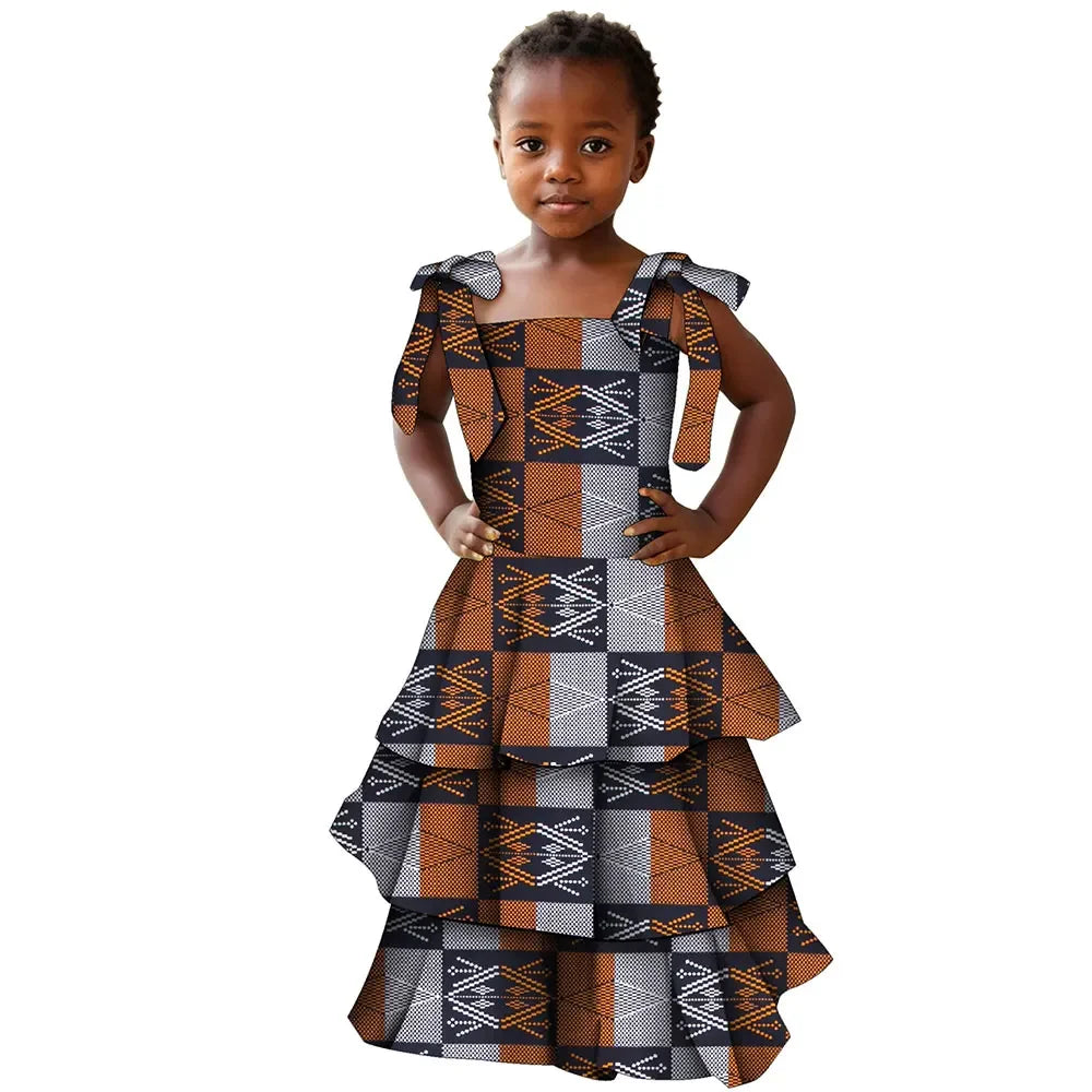 Girl wearing a colorful African print cotton party dress in Bazin Riche style by SHOWLU FASHION STORE.