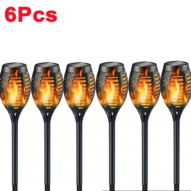 Solar Dancing Flame LED Garden Lantern by Showlu Smart General, showing a decorative outdoor lantern with flickering flame effect in a garden setting.