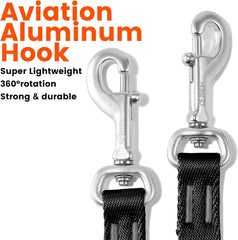 Two silver aviation aluminum swivel hooks attached to black nylon dog leashes.