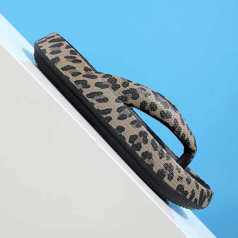 Leopard print women's summer flip-flops with thick soles and cloud-like comfort, ideal for beach and travel wear.