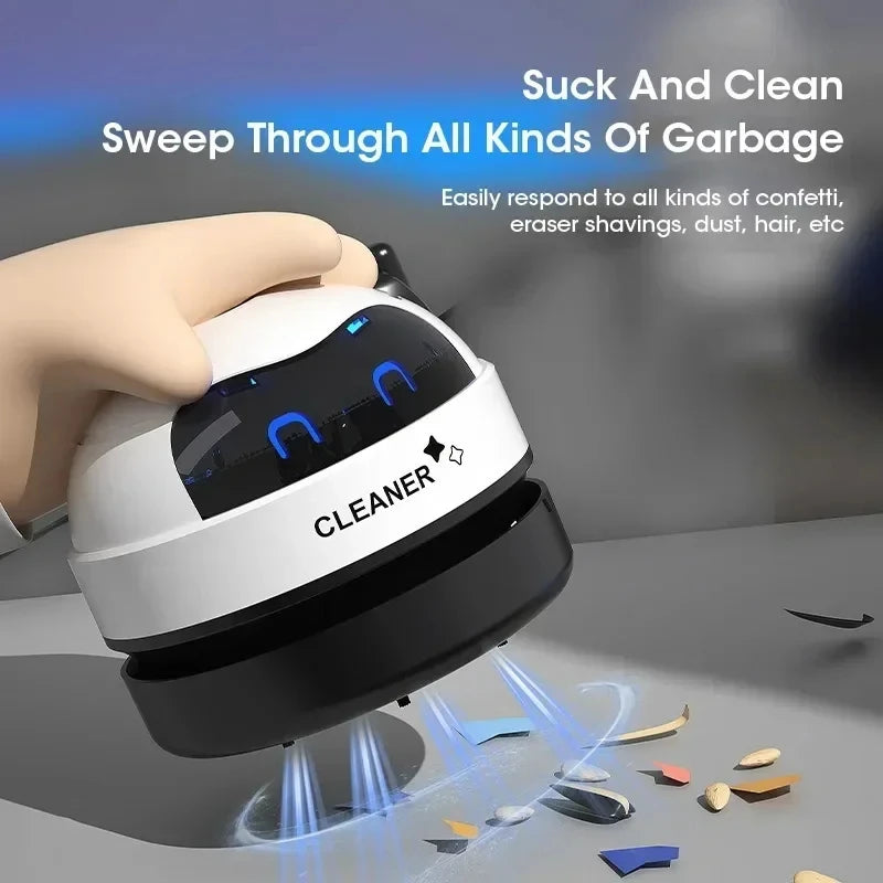 Mini USB robot desk vacuum by Showlu Smart General, compact cleaning device with robot design, black and silver colors on a desk.
