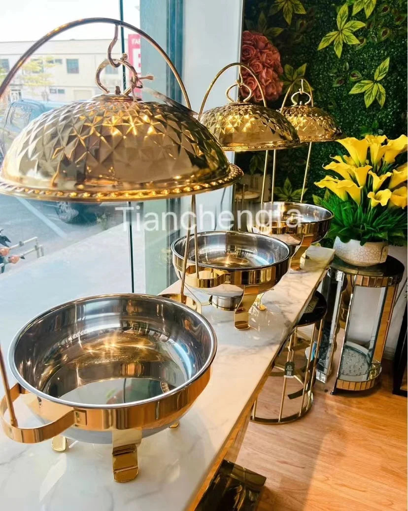 Luxury gold round hanging chafing dishes for hotel buffets, showcasing catering food warmers for restaurant heating and presentation.