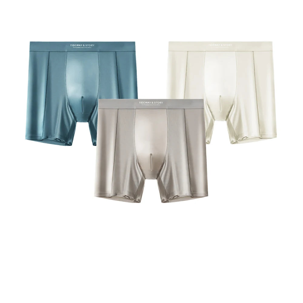 Three pairs of Showlu Fashion satin-like men's boxer briefs featuring breathable, quick-dry, antibacterial ice silk material.