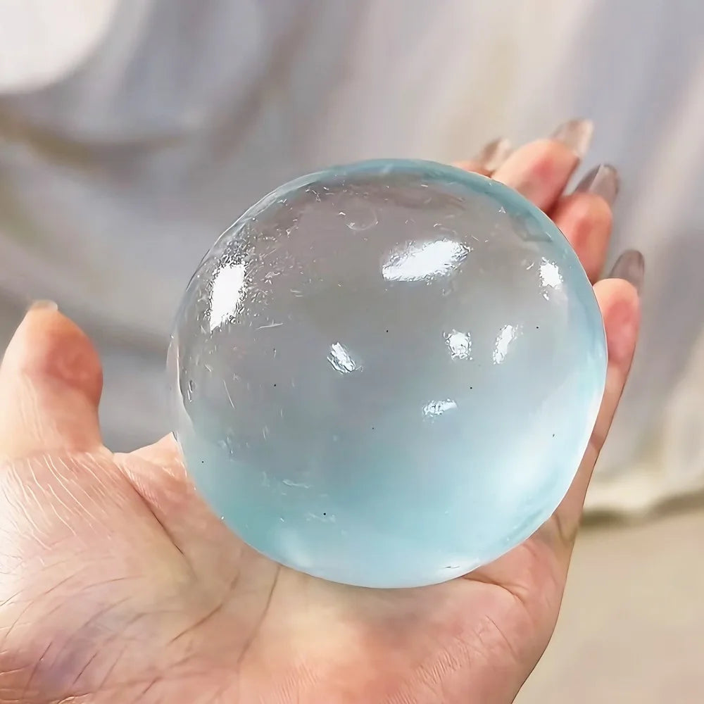 Transparent squishy maltose stress ball from Showlu Fashion Store, slow-rise sensory ball for hand exercise and stress relief.