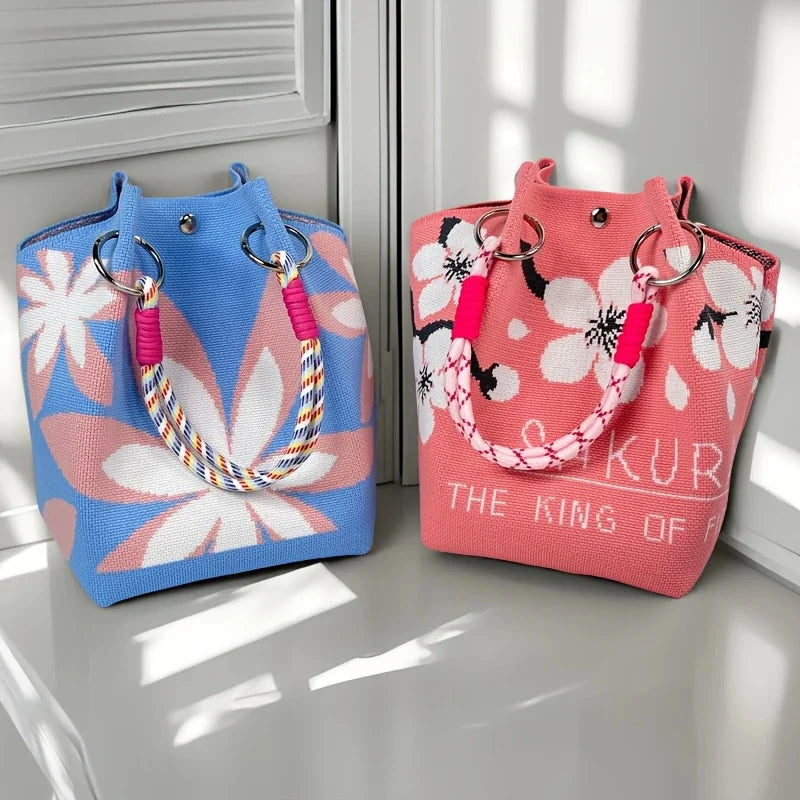Women's vintage floral knit tote bag with adjustable straps, metal rings, snap closure, lightweight design for casual travel.