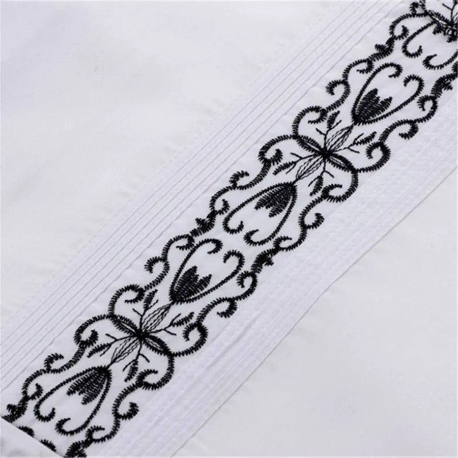 Men's white Guayabera shirt with embroidered Cuban style, made by Showlu Fashion, featuring traditional tropical embroidery and lightweight fabric.