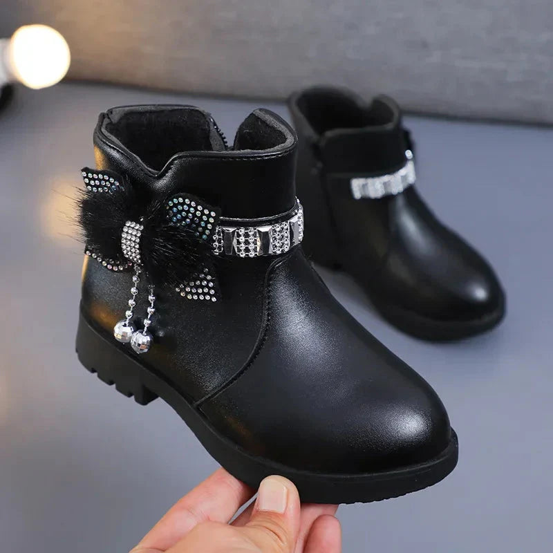 Girls' winter ankle boots by ROMSUNS in plush PU leather, featuring a stylish and cozy design for cold weather.