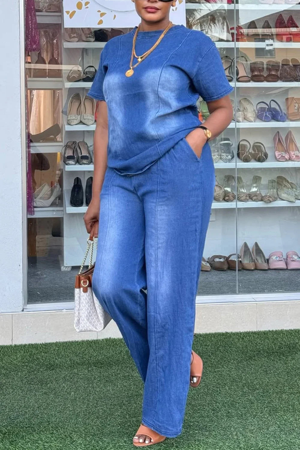 Plus size women's blue Tencel denim two-piece pant set by Showlu Fashion, featuring a stylish and comfortable matching top and pants.