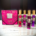 Showlu Fashion Mystical Fruity Fragrance perfume gift set with four travel-sized bottles, vibrant packaging, and fruity scent details.