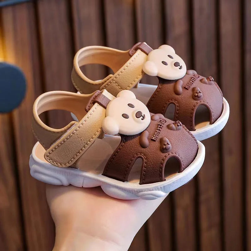 Showlu Baby open-toe clogs with anti-slip soft soles, ideal for infant walking shoes, featuring a comfortable and flexible design.