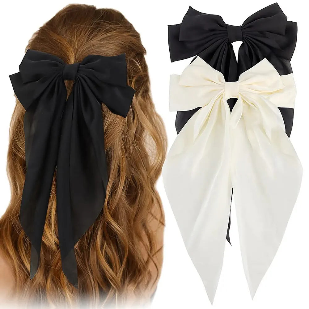 Two elegant satin bow ribbon hair clips for women and girls, featuring solid bowknot design and versatile ponytail accessories.