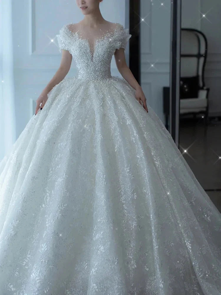 SHOWLU FASHION crystal beaded tulle ball gown wedding dress with intricate embellishments and flowing skirt, elegant bridal attire.