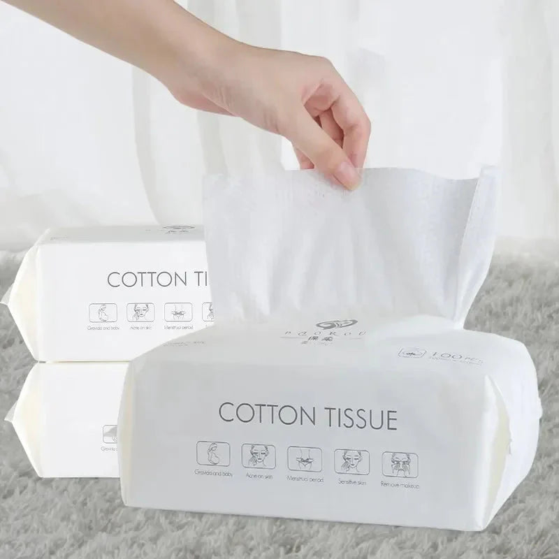 Set of 100 soft cotton disposable face towels from Showlu Fashion, ideal for gentle facial cleansing and skincare routines.