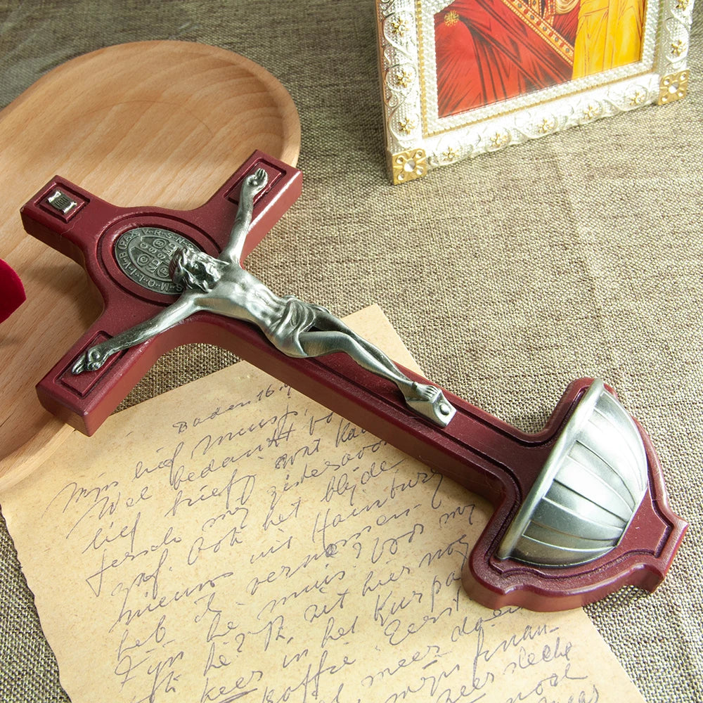 Catholic wooden crucifix with Jesus, Holy Water cup, and religious details, ideal for church or home spiritual decoration.