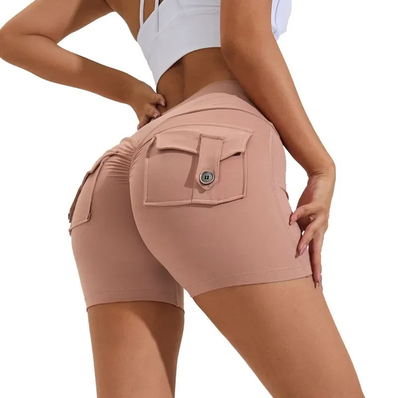 SANWOOD Women's high waist peach yoga shorts with pockets, featuring a flattering fit and comfortable design for active wear.