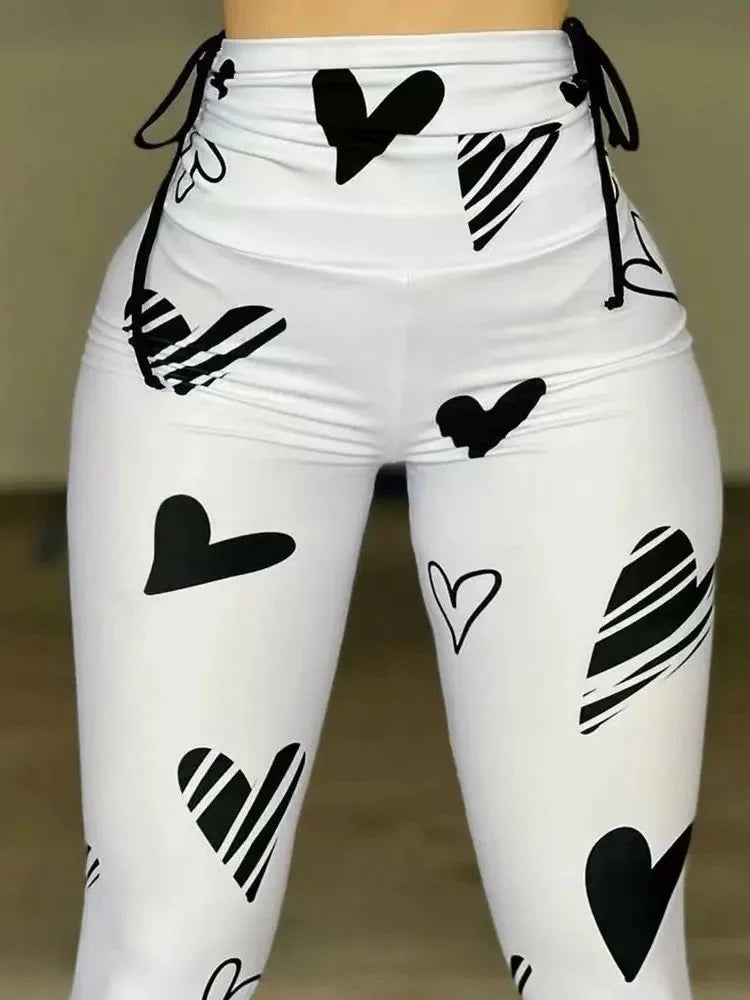 Owner Girl Heart Printed Yoga Leggings by SHOWLU FASHION STORE, skinny sporty pants with heart design and drawstring waist.