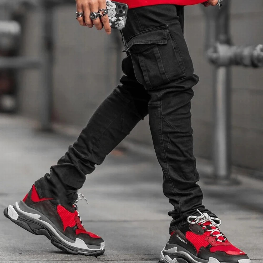 Men's street elastic denim cargo jeans with solid color wash, multiple pockets, slim fit, mid waist, casual jogger style.
