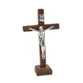 Wooden Catholic Jesus cross with stand, vintage Christian crucifix for church or home tabletop religious decoration.