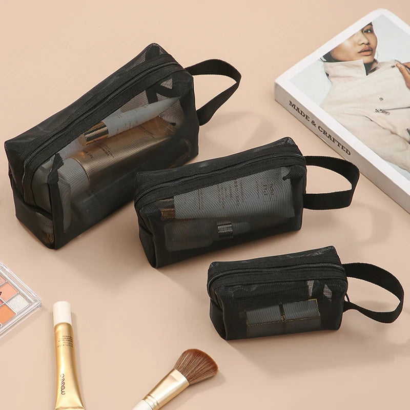 Large black travel cosmetic bag with mesh compartments, ideal for makeup storage and toiletries, by Showlu Fashion Store.