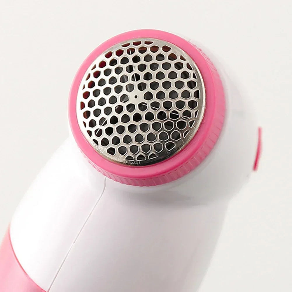 Showlu Smart General electric lint remover fabric shaver with a handheld design, shown on a neutral background.