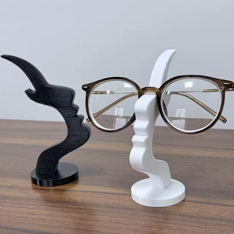 Minimalist 3D printed human profile eyeglass holder by Showlu Fashion, designed to hold glasses with a sleek, modern look.