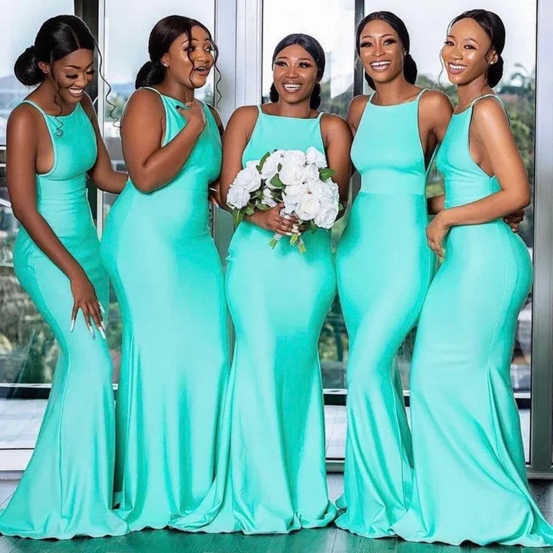 Turquoise mermaid satin bridesmaid dress with a sexy backless design by JC&STAR, featuring elegant fit and flowing fabric.