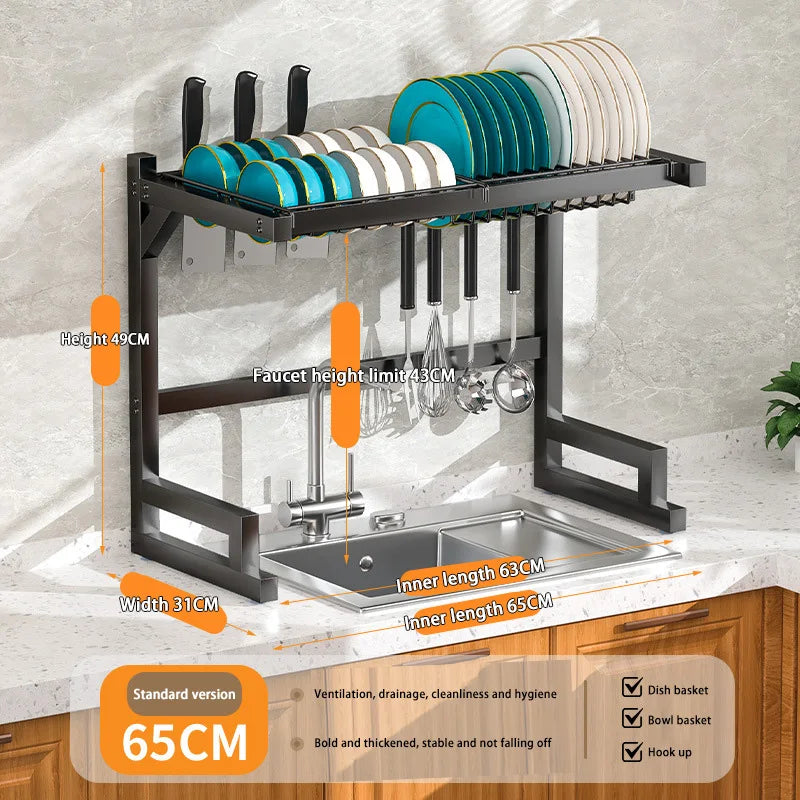 Stainless steel kitchen sink dish drain rack with utensil holder, showing organized space for drying dishes and utensils.