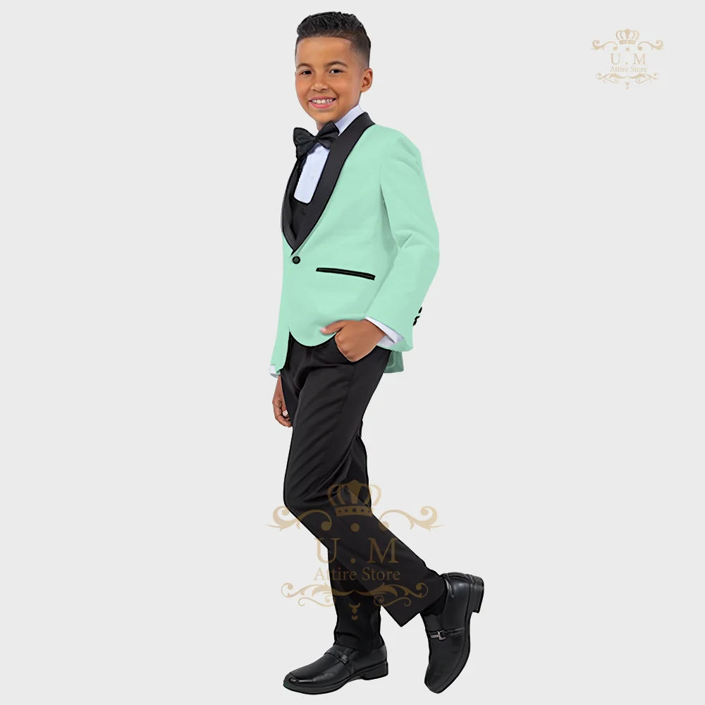 Boy wearing a white tuxedo suit with jacket, vest, and pants, showcasing a formal ZHIO boys' 3-piece suit by SHOWLU FASHION STORE.
