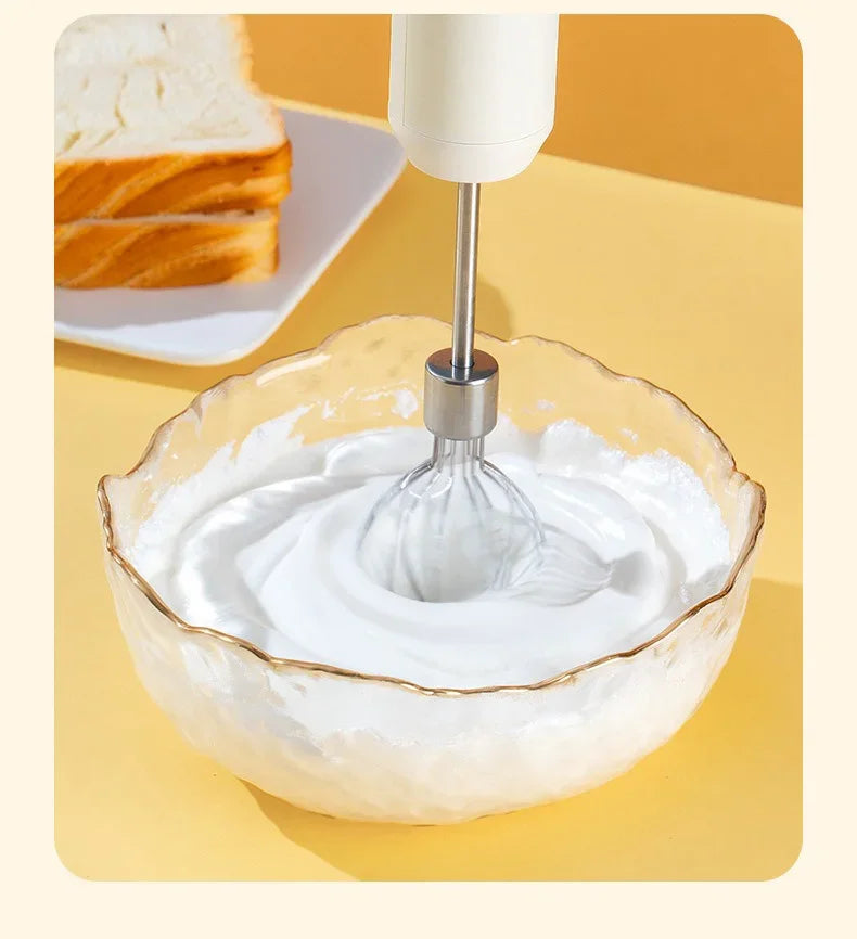 Electric egg beater from Showlu Smart General with stainless steel beaters and ergonomic handle for mixing and whipping.