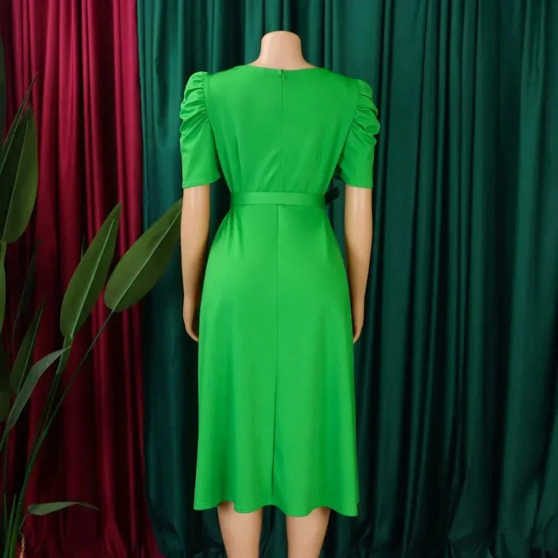 SHOWLU Women's V-Neck Pleated A-Line Dress, elegant mid-calf office gown, black fabric with pleated details and V-neck design.