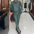 Men's two-piece African Kaftan set featuring traditional Dashiki design, in vibrant fabric with intricate patterns.